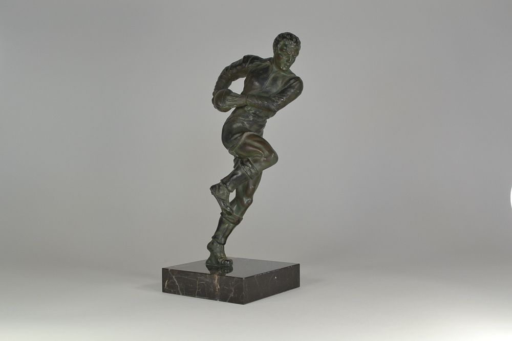 Art deco metal sculpture of a Rugby Player