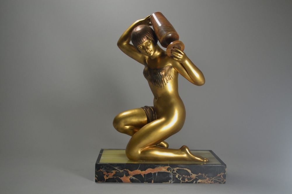 large art deco figure of a lady carrying a jar. Circa 1925