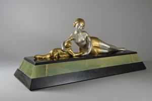Art deco sculpture. Lady playing with a cat. Circa 1930