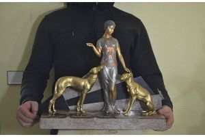 An art deco patinated metal group. Lady with borzois.