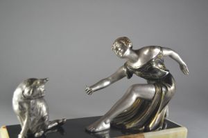 Art deco Sculpture. Woman playing with a cat 