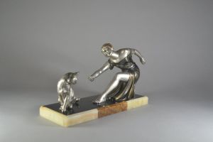 Art deco Sculpture. Woman playing with a cat 